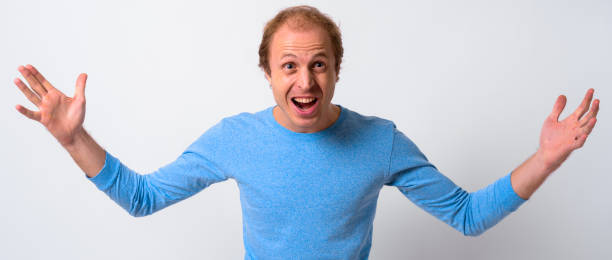 istock Portrait Of Man Against White Background 911573284