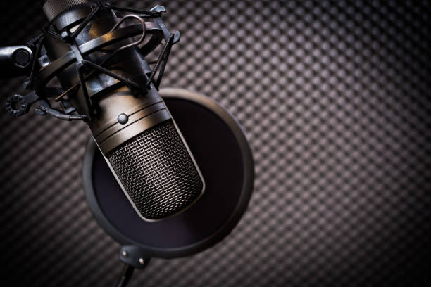 istock condenser microphone in recording studio, music background 911576482