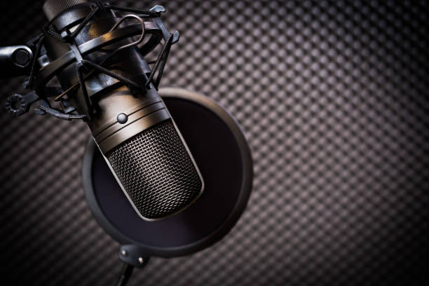 condenser microphone in recording studio, music background stock photo