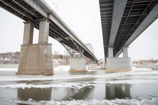 istock A large metal bridge over the river . Bottom view. 911585476
