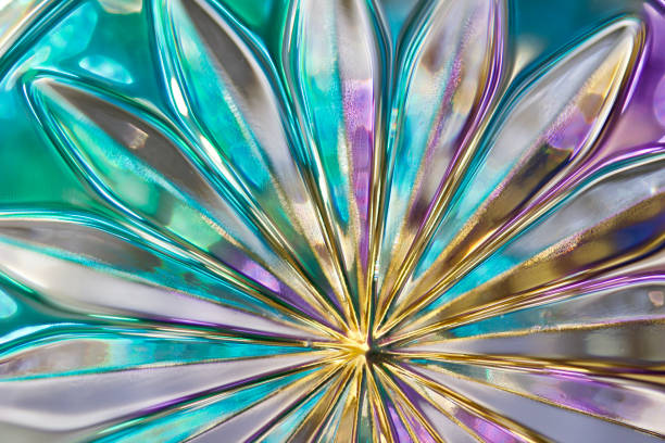 Vibrant color macro abstract of beautiful lead crystal glass designs with bokeh This image shows an extreme close up view of stunning designs in lead crystal glass with bokeh, reflecting bright colors in natural sunlight. lead cut glass crystal stemware stock pictures, royalty-free photos & images