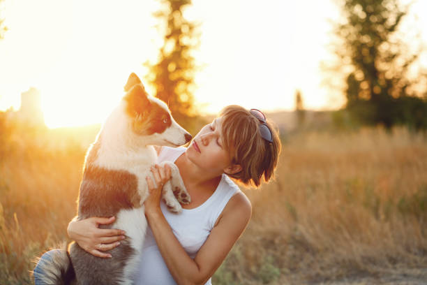 istock The girl hugs the dog 911590384