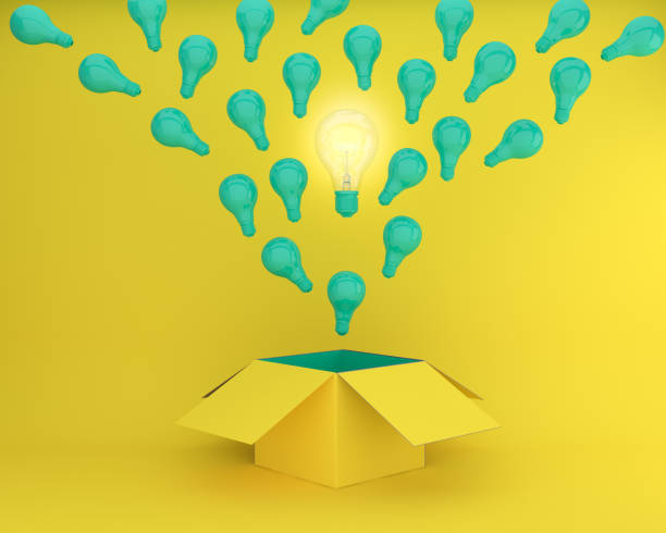 istock green Light bulbs glowing the different creative idea think outside the box on yellow background , Concept idea about Business for innovation and inspiration. 911603982