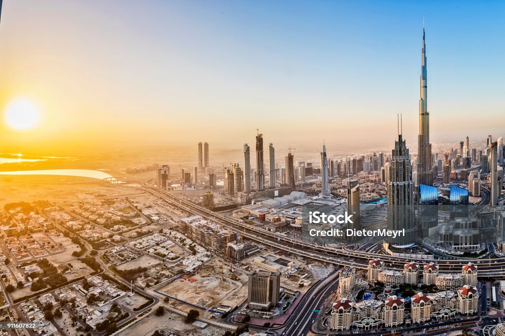 City lights in Dubai at sunrise Dubai, Burj Khalifa, United Arab Emirates, Sunset, Cityscape Dubai Stock Photo