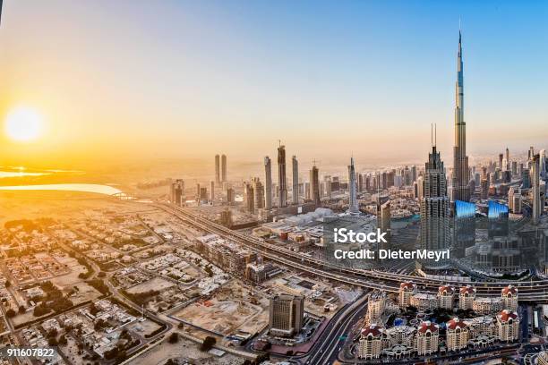 City Lights In Dubai At Sunrise Stock Photo - Download Image Now - Dubai, United Arab Emirates, Urban Skyline