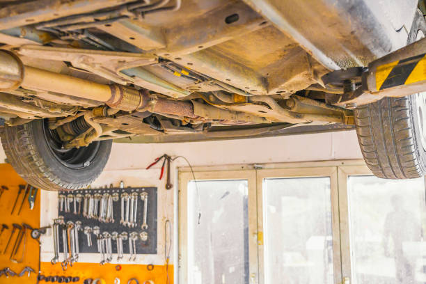 istock Underside of a car.Car ready for repair service. 911618660