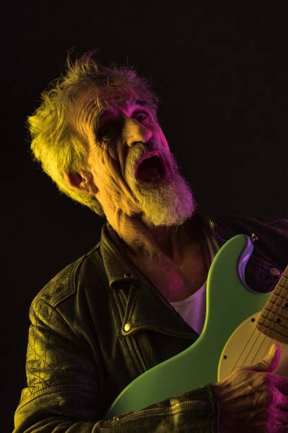 istock Ageing rocker belting one out 911626624