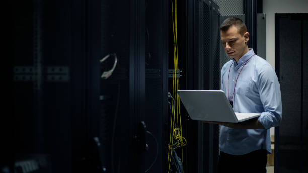 IT technician in server room IT technician in server room. Shallow DOF. Developed from RAW; retouched with special care and attention; Small amount of grain added for best final impression. 16 bit Adobe RGB color profile.Quality control inspection in the factory. Shallow DOF. Developed from RAW; retouched with special care and attention; Small amount of grain added for best final impression. 16 bit Adobe RGB color profile.Quality control inspection in the factory. Shallow DOF. Developed from RAW; retouched with special care and attention; Small amount of grain added for best final impression. 16 bit Adobe RGB color profile.Quality control inspection in the factory. Shallow DOF. Developed from RAW; retouched with special care and attention; Small amount of grain added for best final impression. 16 bit Adobe RGB color profile. cable network connection plug computer cable internet stock pictures, royalty-free photos & images