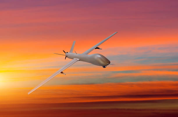 istock Unmanned military aircraft on white background sunset sky. 911632854