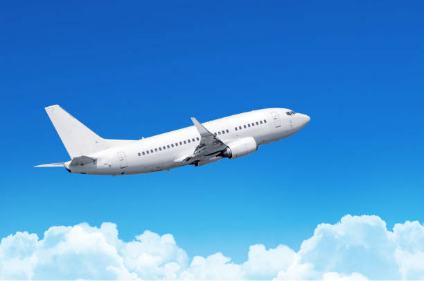 istock Passenger plane fly on a train above clouds and blue sky. 911633088