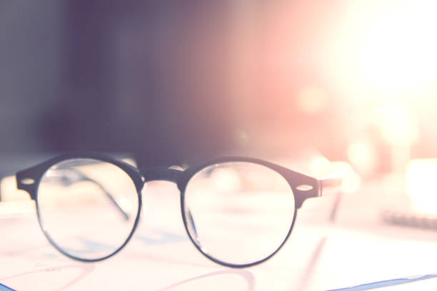 istock vintage glasses,on table in Studying examining. Tutor books with friends. Young students campus helps friend catching up and learning. People, learning, education 911637332