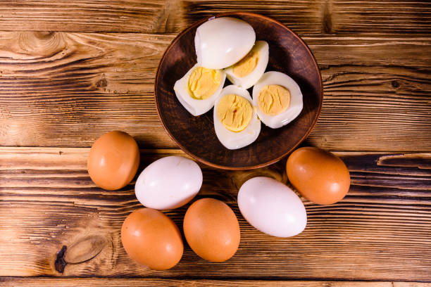 istock Boiled eggs on the old wooden table 911642290