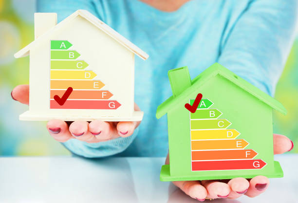 istock concept comparison between normal house and low consumption house with energy efficiency rating 911645252
