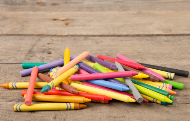 istock Crayons on the wooden desk 911649264