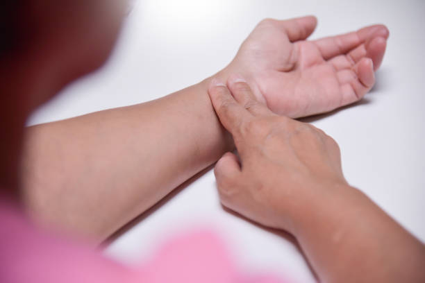 istock Asian Senior Female checking her pulse. 911649794