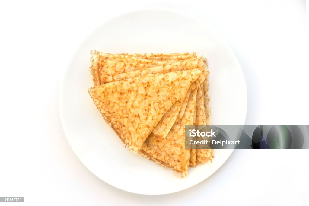 Close up on a stack of folded crepes (french pancakes) on a plate, white background Breakfast Stock Photo