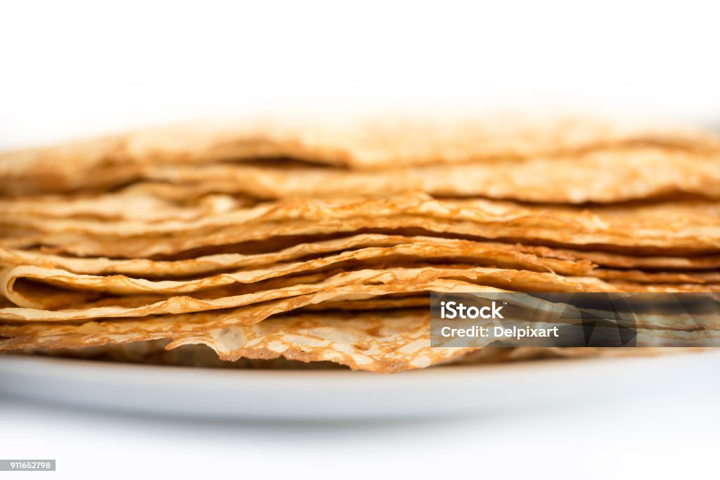 Close up on a stack of crepes (french pancakes) on a plate, white background Breakfast Stock Photo