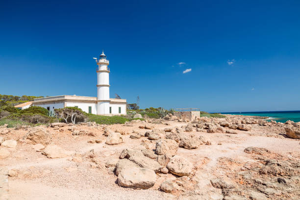 istock Lighthouse at Cap de Ses Salines. Mallorca island, Spain.This lighthouse is located at the southernmost point of Mallorca. 911656962