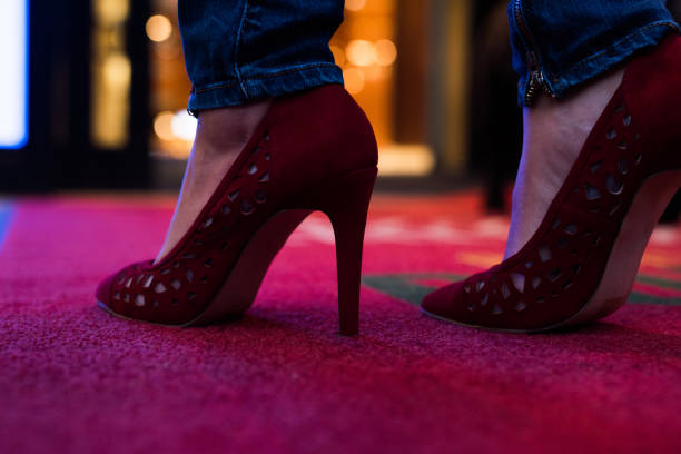 istock Close up of heels on the red carpet. 911657030