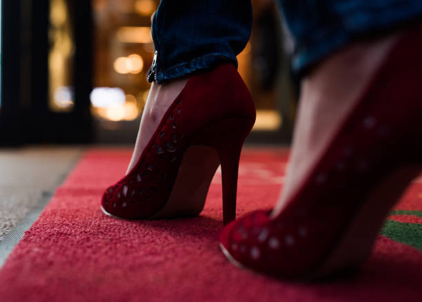 istock Close up of side view on red high heels. 911657324