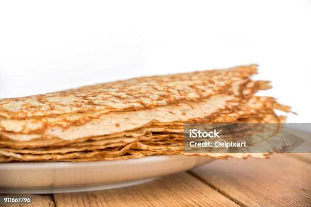 Close Up On A Stack Of Crepes On A Plate White Background Stock Photo - Download Image Now