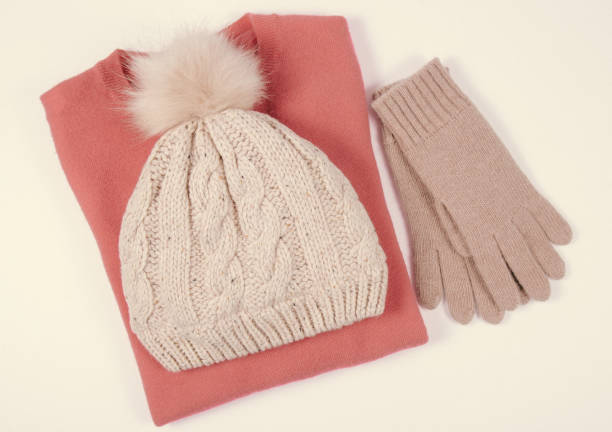 istock Wool hat, sweater and gloves for winter weather on a white background. 911668148