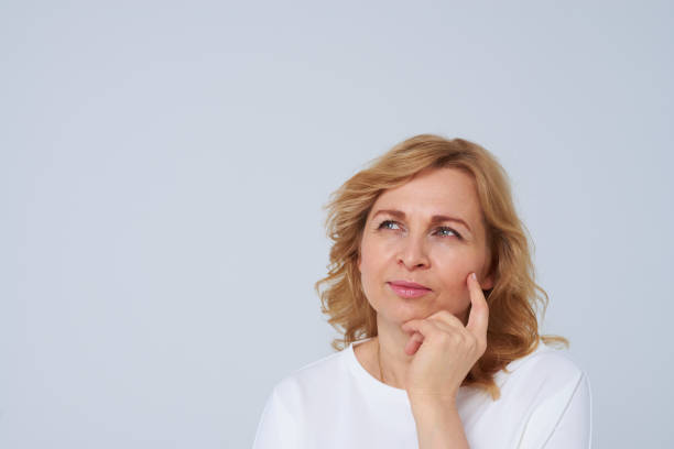 istock Beautiful mature woman thinking 911668344