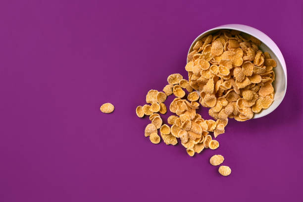 istock Bowl with cornflakes on the colorful background 911671690