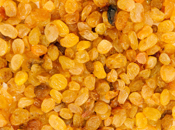istock golden raisins background 911671752
