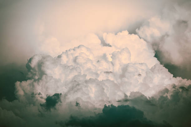 istock Cloud Typologies: Cumulus Clouds in moody Sky during Sumer Monsoon Thunder Storm 911674692