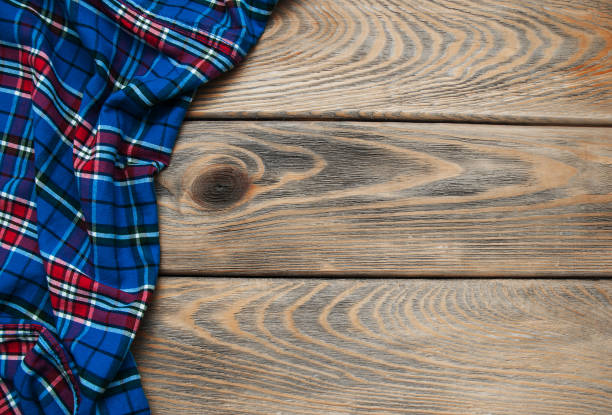 istock Checkered napkin on a wooden background 911678270