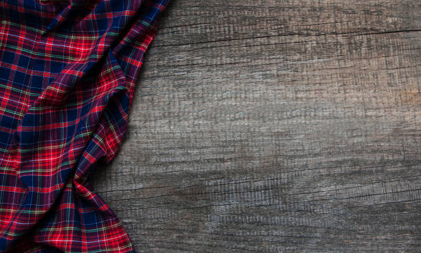 istock Checkered napkin on a wooden background 911678278