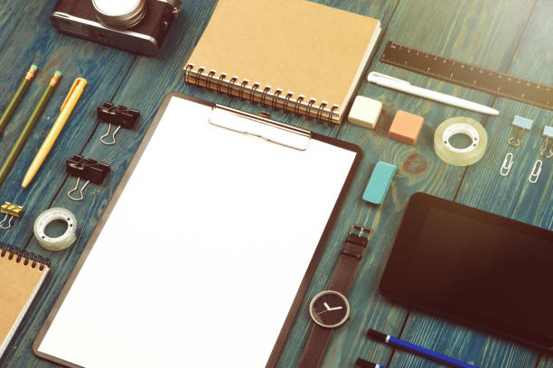istock Workplace with tablet pc, camera, watch and other office supply 911678672