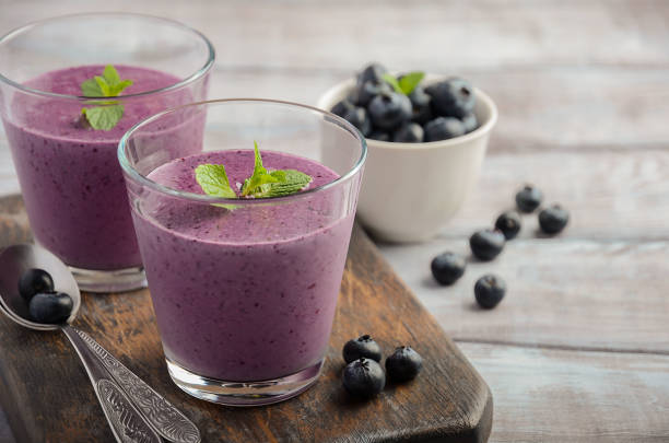 istock Blueberry smoothie on the wooden table. 911679050