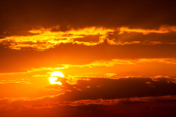 sun ray is go down and amazing dramatic  orange cloud during sunset, twilight sky