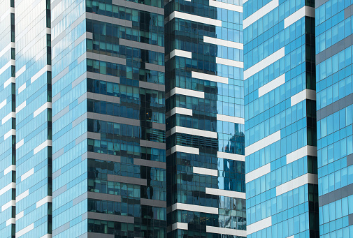 Glass facade of modern city high buildings