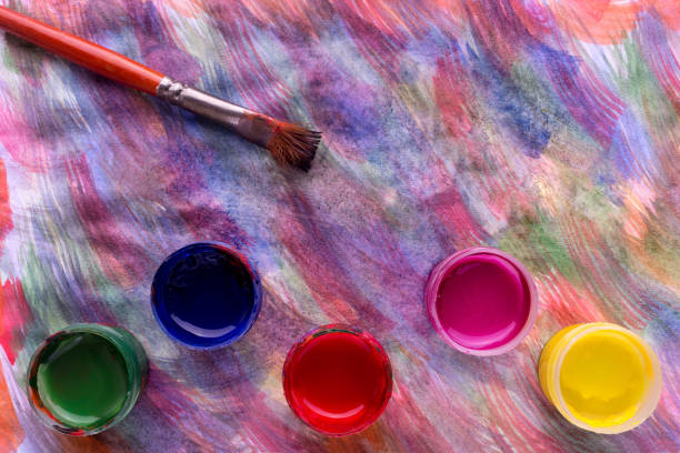 istock Colorful paints and artist brushes 911681174
