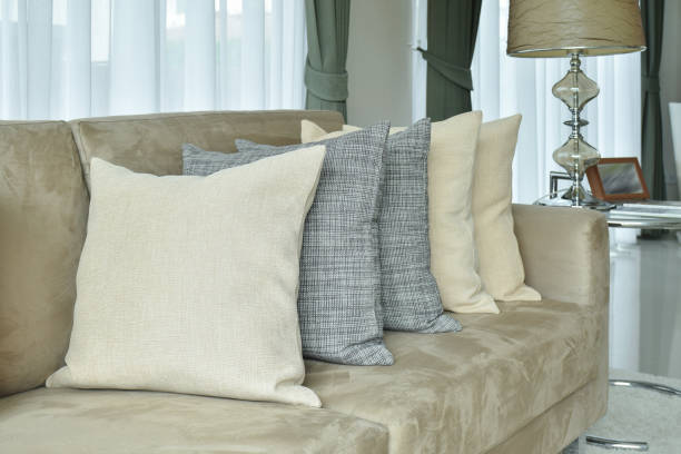 istock Earth tone pillows setting on light brown sofa in the living room 911687028