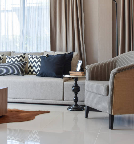 istock stylish living room design with grey striped pillows on comfortable sofa 911687450