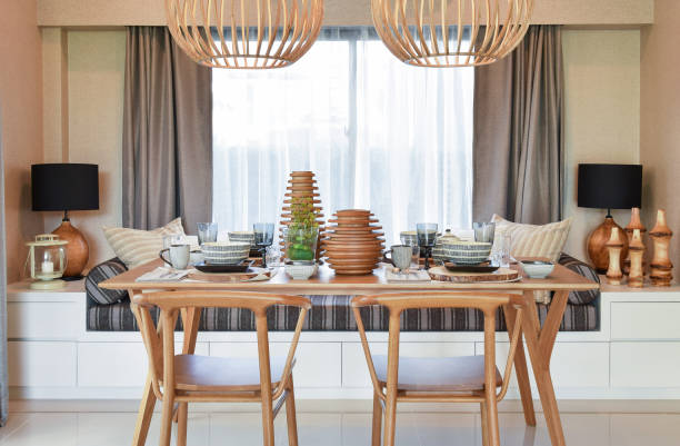 istock dining wooden table and comfortable chairs in modern home with elegant table setting 911691544