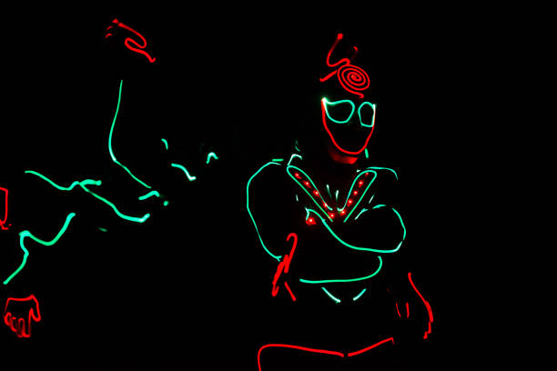 istock dancers in led suits on dark background, colored show 911691582