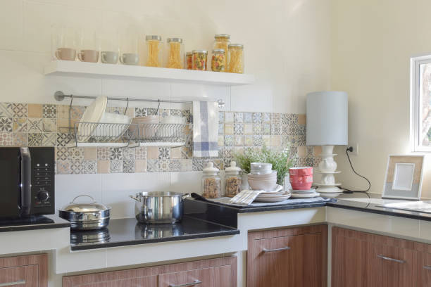 istock modern ceramic kitchenware and utensils on the black granite countertop 911691626