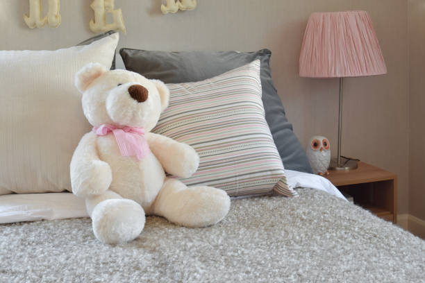 istock modern kids room with doll and pillows on bed 911693668