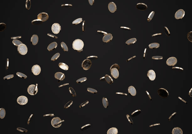 istock Falling British one pound coins on dark/black background (sharp focus) 911694210