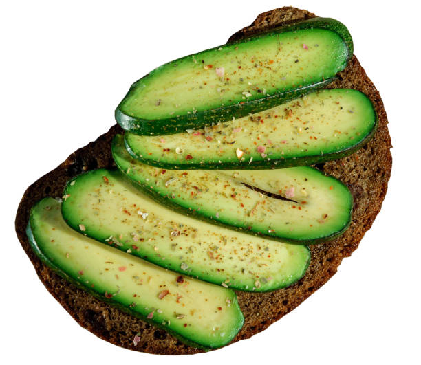 istock Sandwich with seedless avocado isolated on white. Avocado without any seed. Cocktail avocado. Cucumber avocado. Marks and Spencer new genetic gift for avocado fans. 911694766