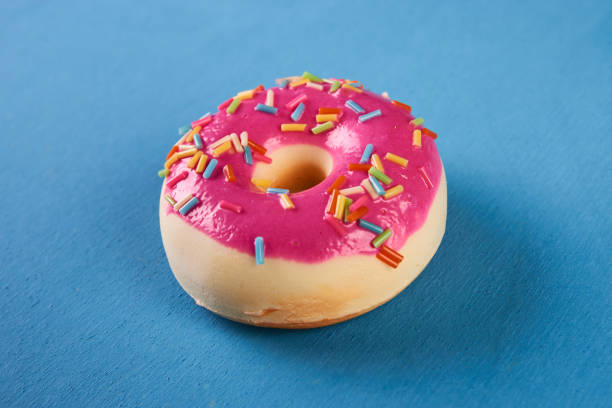 istock Pink doughnuts or donut glazed with sprinkles 911699098