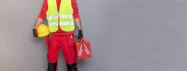 istock Hands of Plumber with a wrench 911699448