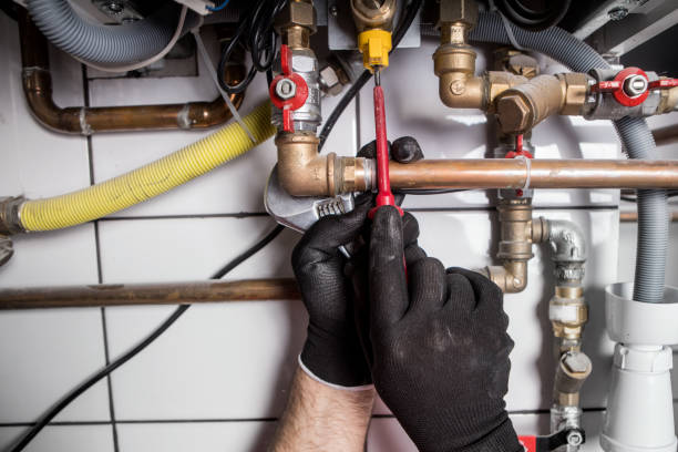 istock Hands of Plumber with a wrench 911699502