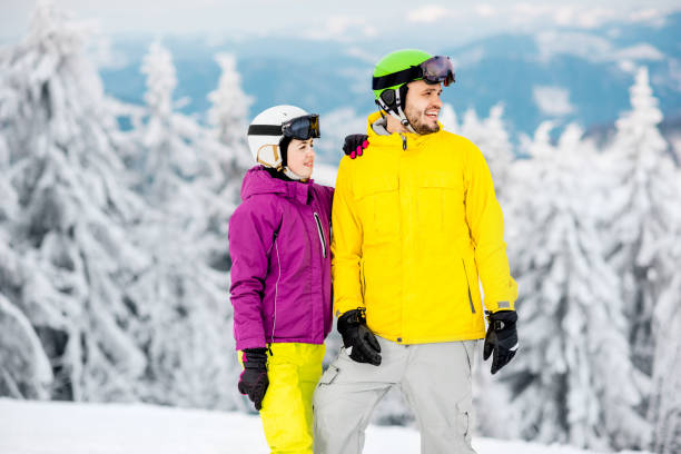 istock Couple on the snowy mountains 911702194