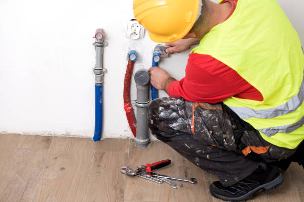 istock Hands of Plumber with a wrench 911702672